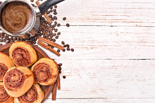 Cinnamon rolls with coffee. Background.