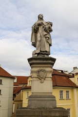 Fototapeta na wymiar Statue of Saint Philip Benizi de Damiani on Charles bridge in Pr