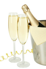 Glasses of champagne with bottle in a bucket on white background