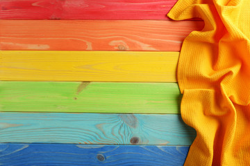 Napkin on colorful wooden table, close up