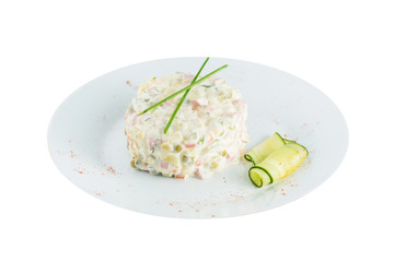 Russian Olivier salad on plate isolated
