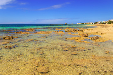 SUMMER.Ionian coast of Salento:Torre Pali beach (Lecce). ITALY (Apulia).The low sandy coastline is characterized by dunes covered with Mediterranean scrub.