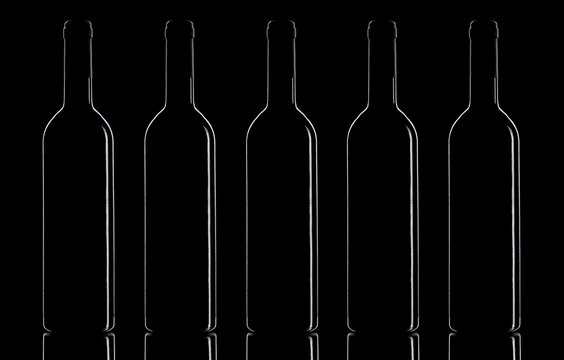 Wine bottles on a black background