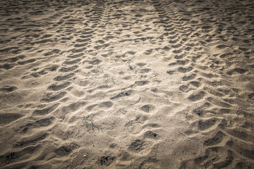 Wheel tracks on a sand. Natural background
