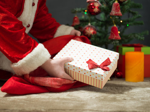 holidays, celebration and people concept - close up of santa cla