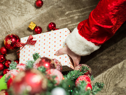 holidays, celebration and people concept - close up of santa cla