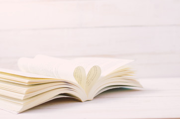 Open Book with heart shape in the middle page