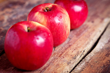 Fresh apples on the wooden table