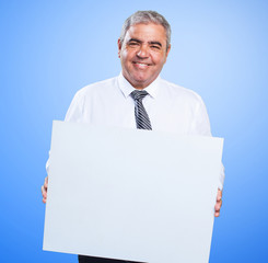 mature man holding a banner