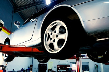 The car on the lift prepared to repair
