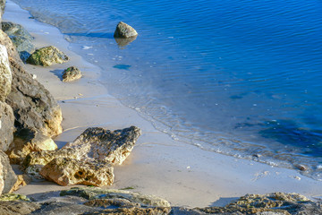 Beach with fine sand, rock, turquoise water at Andernos Les Bains, south of France.