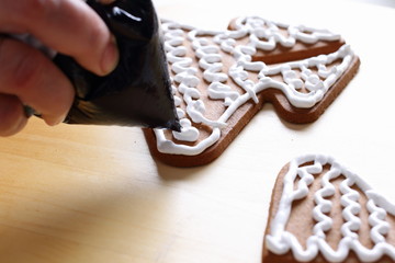 Decorating gingerbread cookies.