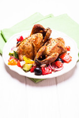 Baked quail with salad
