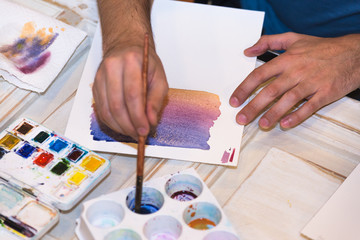 Hands mixing Water Colors