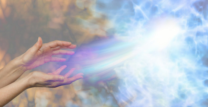 Soul midwife - female hands on a darkness to light background and a soul energy formation moving out towards the light depicting soul release