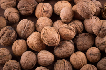 Walnuts whole in their skins, chopped, nut hulls, walnut kernels