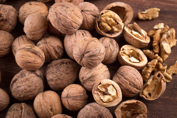 Walnuts whole in their skins, chopped, nut hulls, walnut kernels