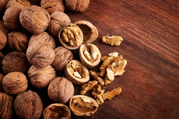 Walnuts whole in their skins, chopped, nut hulls, walnut kernels