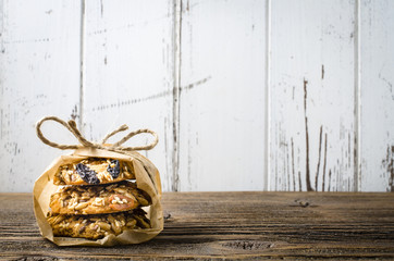 Tasty cookies on old wooden table - obrazy, fototapety, plakaty
