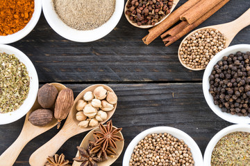 Spices and herbs in  bowls.