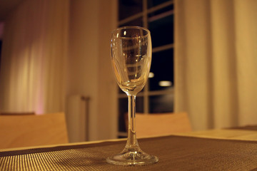 Empty glass on the restaurant table at night