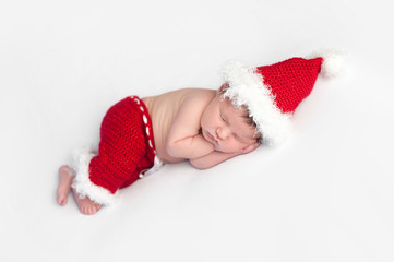 Newborn Baby Girl Wearing a Santa Suit