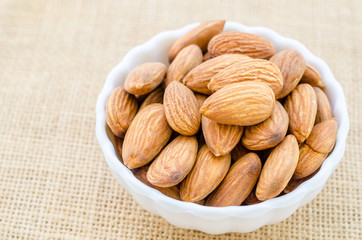Almonds in white cup.