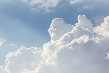 Beautiful light blue sky with puffy white clouds