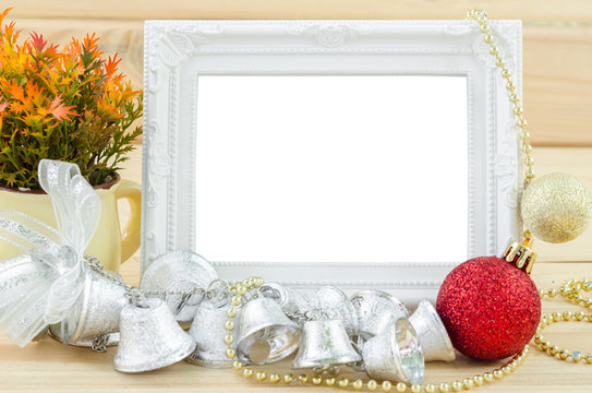 Vintage white blankk photo frame with chirstmas decorations.