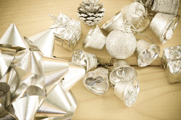 Silver bell and silver ribbon in vintage background.
