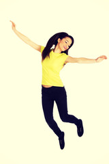 Young casual woman jumping. 