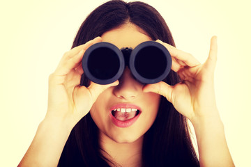 Young woman with binoculars.