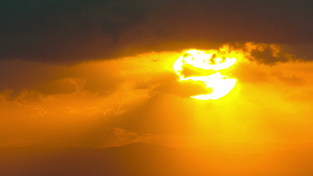 4K sunrise timelapse close up over horizon mountain clouds