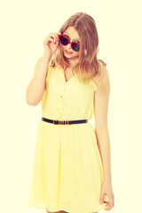 Young caucasian woman wearing skirt and sunglasses