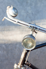 Vintage bicycle handlebars with gray background
