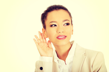 Beautiful businesswoman overhears.