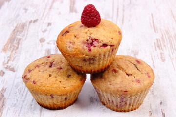 Fresh baked muffins with raspberries, delicious dessert