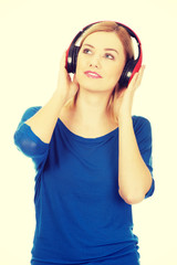 Naklejka premium Woman with headphones listening to music. 