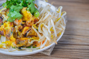 fried mussel pancake with old wooden background