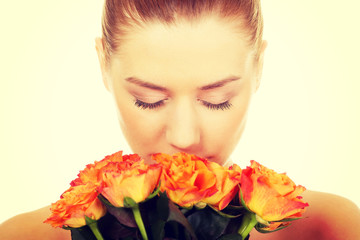 Fototapeta premium Smiling woman with fresh roses.