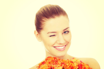 Fototapeta premium Smiling woman with fresh roses.