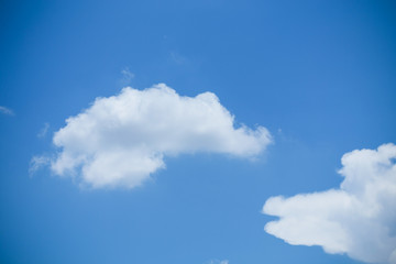 single cloud on clear blue sky background
