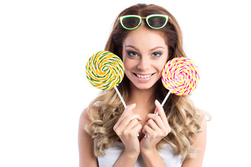 Beauty fashion model girl and colourful lollipop.
