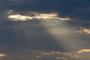 Naklejka na ściany i meble ray light of sun through cloud
