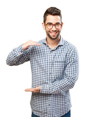 Naklejka premium young man showing a size