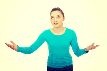 Teen woman holding something on hands.