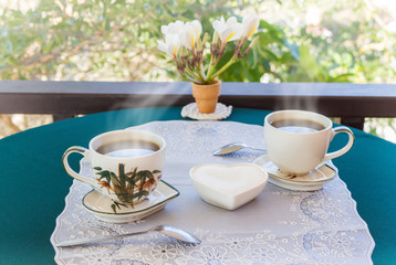 Relaxing time and happiness with two cups of black coffee with sugar