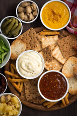 assortment delicious appetizers with different sauces, top view