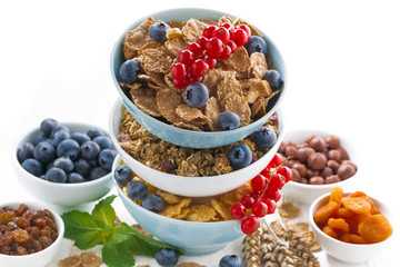 assortment of breakfast cereal and fresh berries, closeup