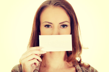 Happy woman with blank paper.